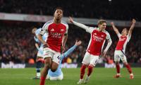 PICS: Arsenal thump City to stay in title race