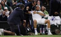 PIX: Injury halts Dimitrov's charge on struggling Sinner