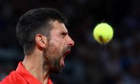 Can Norrie halt history-chasing Djokovic?