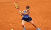 Paolini survives Yuan scare at French Open