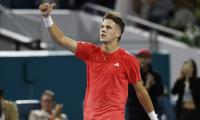 Djokovic protege Mensik beats jeers and Muller to advance