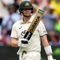 Steve Smith celebrates his fifty.