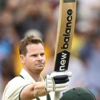 Steve Smith celebrates his century.