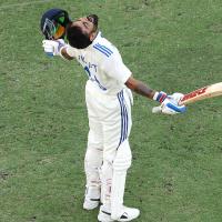 Virat Kohli celebrates his century.