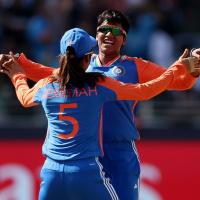 Deepti Sharma celebrates taking a wicket against Pakistan with a teammate.