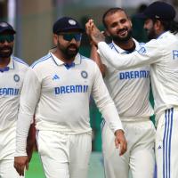 Akash Deep celebrates with teammates after the wicket of Zakir Hasan.