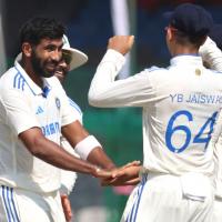 Jasprit Bumrah celebrates with teammates after taking the wicket of Mushfiqur Rahim.