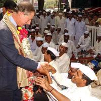 Prince Charles and now King Charles III with dabbawalas in 2015