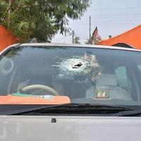 The damaged windscreen of a vehicle in JP Nadda's convoy