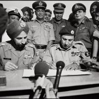 Lt Gen A A K Niazi signs the Instrument of Surrender