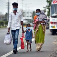 A family in Vijaywada, AP, walks home