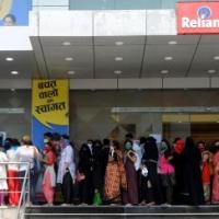 Shoppers without the mandated 3-ft distance queue up at store in Mumbai