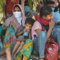 Migrants await screening in Lucknow