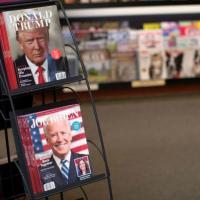 Magazines with Democratic presidential nominee Joe Biden and US President Donald Trump on their covers are pictured in Los Angeles, California.