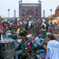 People shop at a market in Delhi
