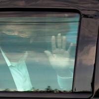 Donald Trump waved from inside his vehicle during the trip outside Walter Reed military medical center