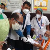 Mai Handique being felicitated by doctors after her recovery