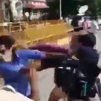 A video grab of the fisticuffs between the journalists