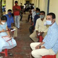 People wait to get vaccinated