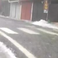 A video grab of water gushing through a street in Nainital