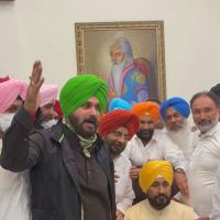 The new Punjab CM (seated) with Navjot Singh Sidhu