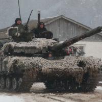 Ukrainian Armed Forces drive a tank during exercises in the Kharkiv region