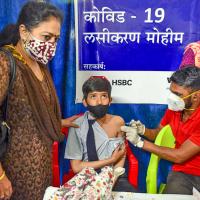 A child gets his vaccination against Covid