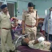 DIG Satya Veer Singh meets a victim of mass shooting at a hospital in Begusarai/ANI