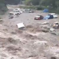 Cars parked along the Beas river in Manali washed away