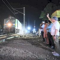 Ashwini Vaishnaw waves at a goods train as services resumed on Sunday