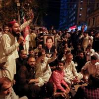 Imran Khan's supporters outside his home. REUTERS/Akhtar Soomro