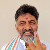 DK Shivakumar shows his finger