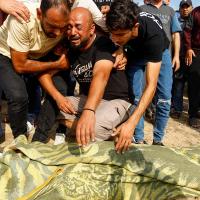 A man grieves the death of a Palestinian. Reuters/Ibraheem Abu Mustafa