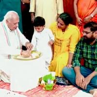 Kerala Governor Arif Mohammed Khan helps a child write his first letters on Vijayadashmi/ANI on X