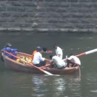 A Mumbai crime branch team in the Tapi river