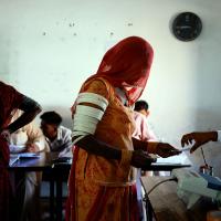 A woman votes at a polling station during the second phase of LS elections, in Barmer, Rajasthan/Adnan Abidi/Reuters