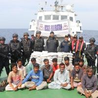 Coast Guard personnel with seized drugs and arrested persons/Courtesy ICG on X