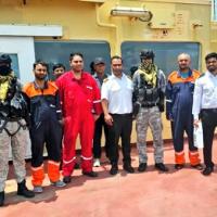 Indian Navy officials with rescued Panama oil tanker crew members/Courtesy Indian Navy on X