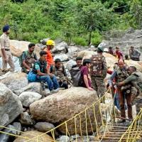 Army personnel help people affected by the cloudburst