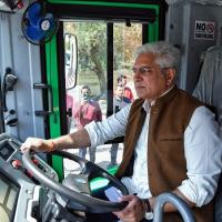 Delhi transport minister Kailash Gahlot test rides the newly introduced Mohalla Bus/ANI Photo
