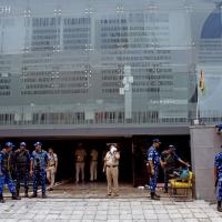 RAF and police personnel stand guard outside the Rao IAS Study Centre