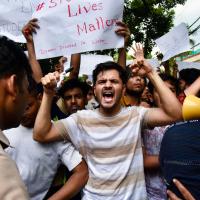 Students stage a protest outside the Rao IAS Study Centre