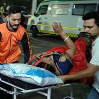 An injured pilgrim being taken to hospital in Reasi