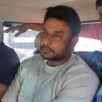 Kannada actor Darshan Thoogudeepa (middle) in police custody/ANI Photo