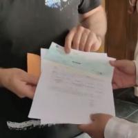 The rape survivor's husband receives a cheque from the govt