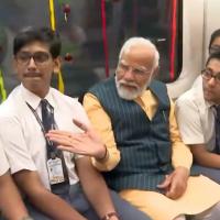Modi takes a ride in the underwater metro with school students