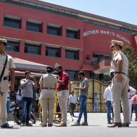 Delhi police stand guard outside a school in Delhi after a bomb threat/ANI Photo