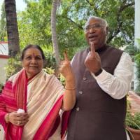 The Kharges show their inked fingers