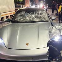 The damaged Porsche car
