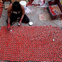 A man in Delhi keeps diyas ready ahead of Diwali